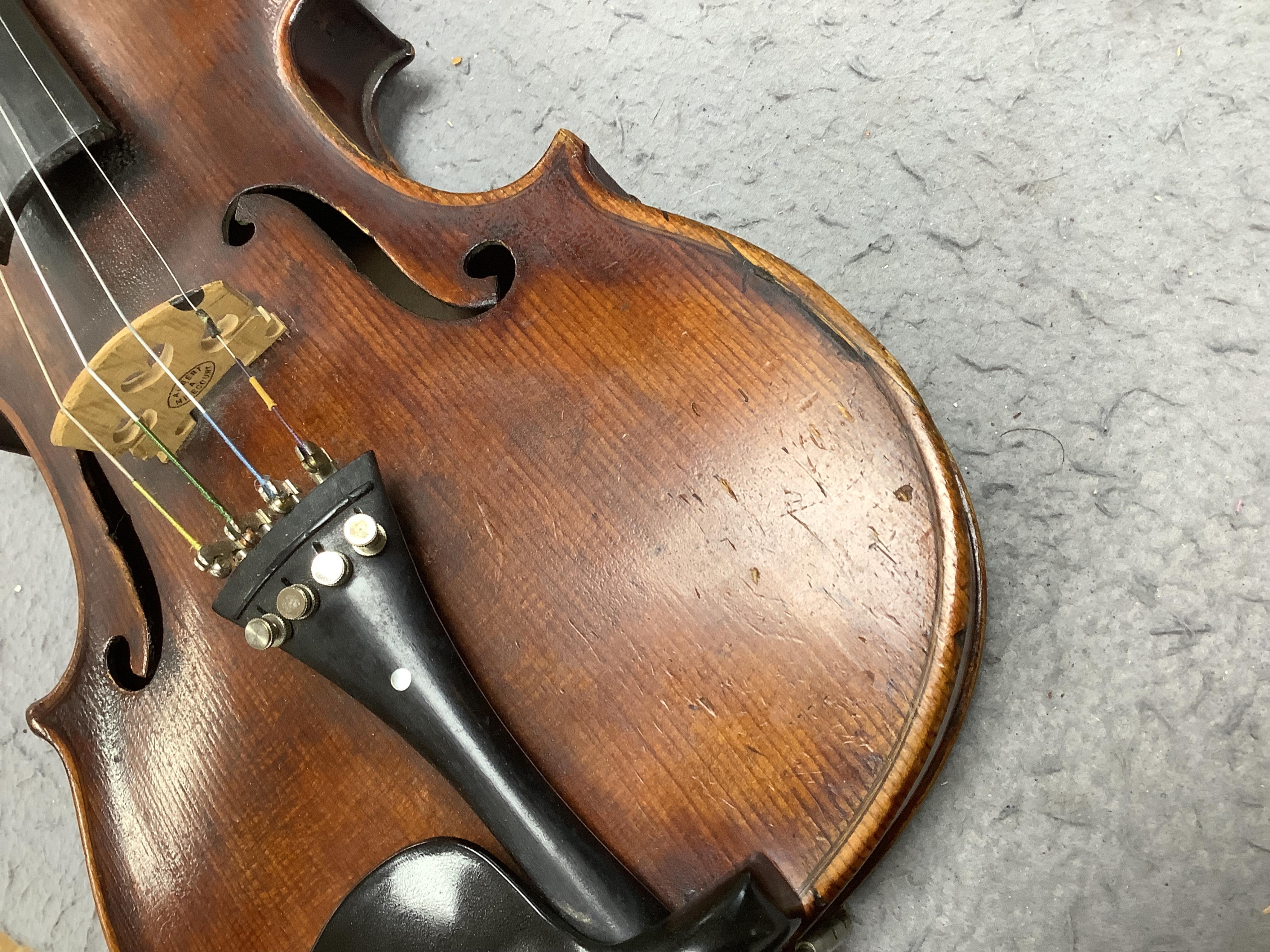 A cased 19th century English violin, with label reading George Craske, Fecit 1842, Edward Crompton, 54, Barton Arcade, Deansgate, Manchester, body length 36cm. Condition - fair to good.